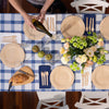 A spring tablescape featured Veneerware Plates with an Arch Board for serving. bambu