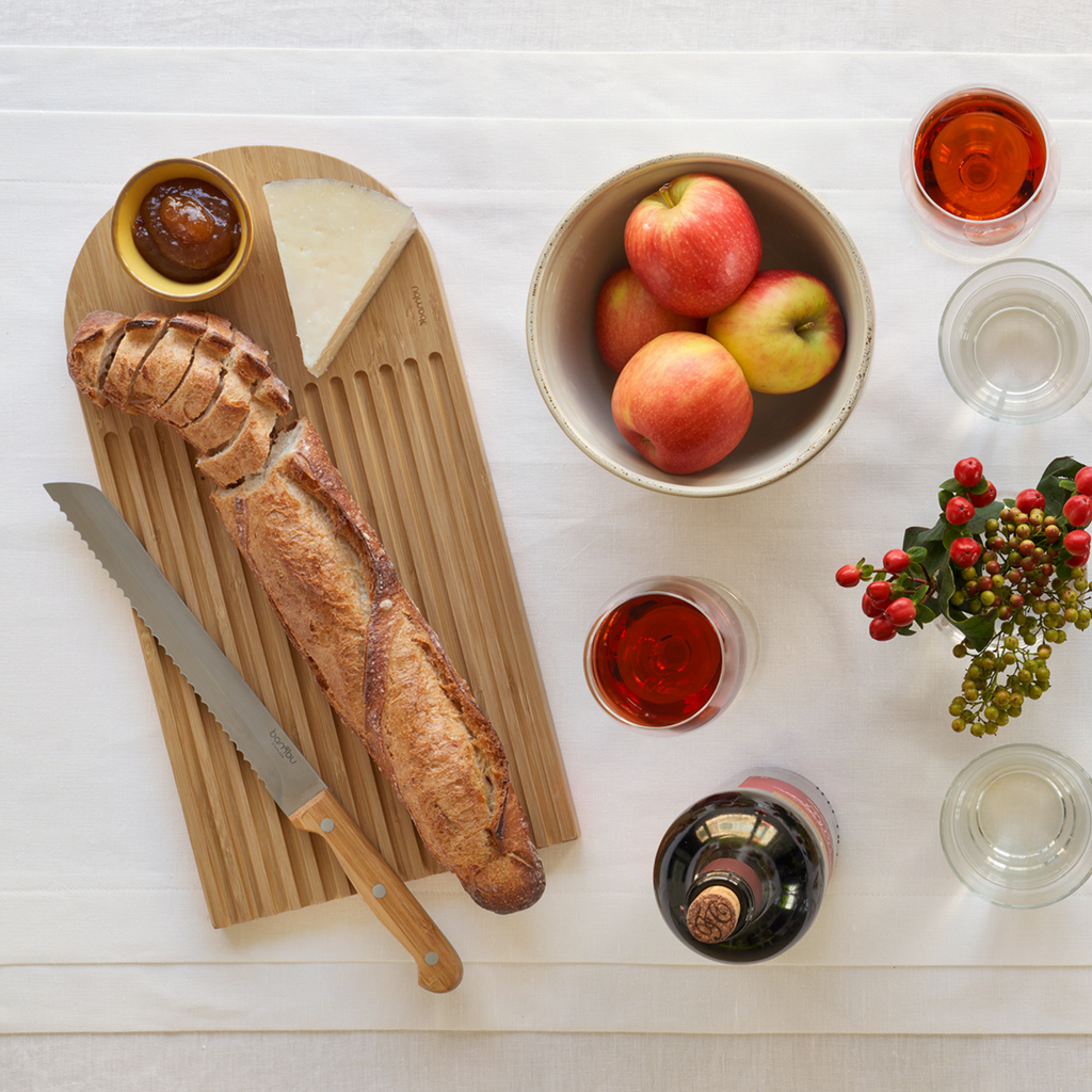 Arch Bread Board will catch crumbs and can double as a serving platter with bread and spread. bambu