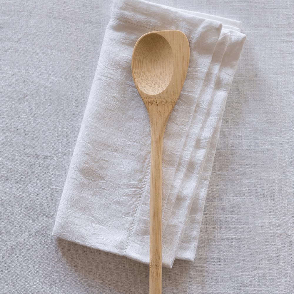 A Spoontula is laid on a white tea towel