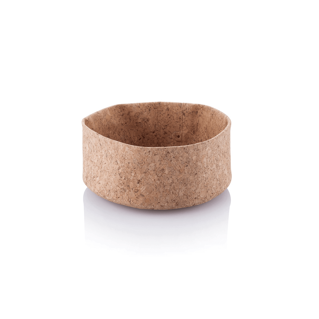A cork bowl is show with the sides unfolded on a white background.