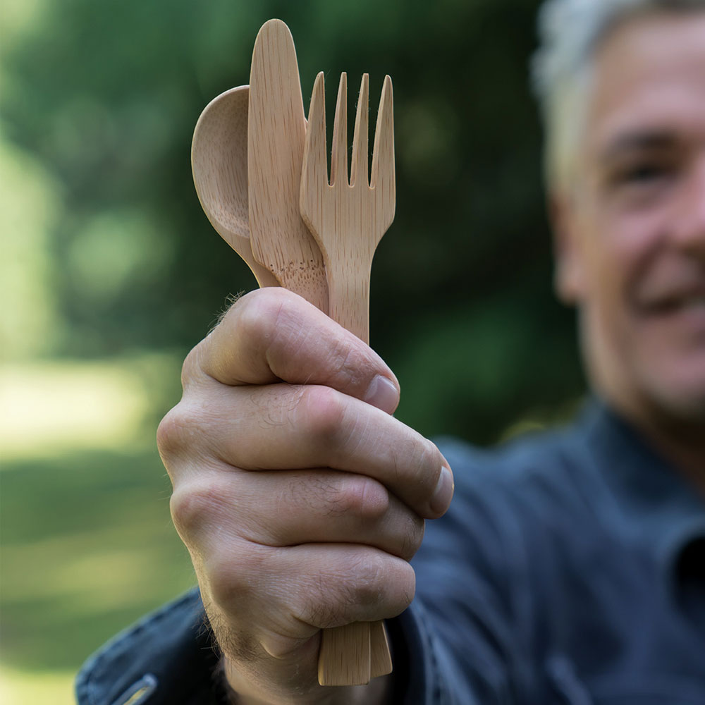 Bamboo Cutlery Set: Spoon, Knife & Fork held in hand