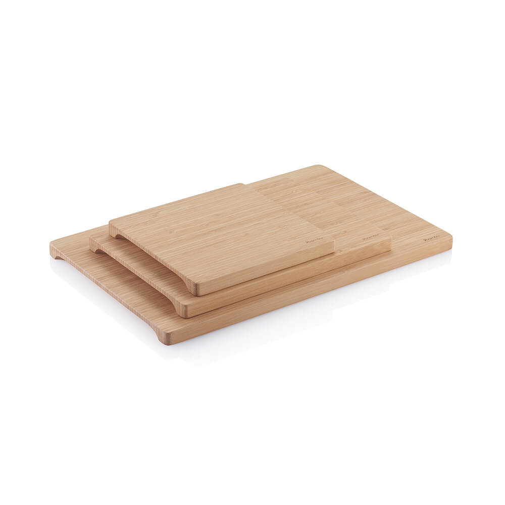 Undercut Series Cutting Boards are stacked up to show the size options. The image is angled so you can see the Undercut design on the bottom of each board.