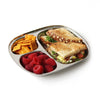 A stainless steel kids food tray holds berries, crackers, and a cut vegetable sandwich.